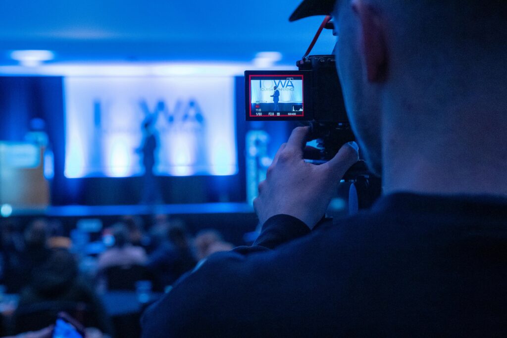 Capturing a conference event with a focus on professional videography services.